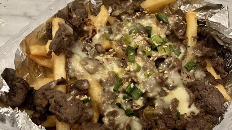A9. Gangnam Fries · Beef bulgogi and melted mozzarella cheese on top of crispy fries served with house wasabi mayo