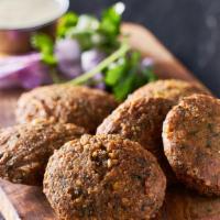 Falafel ( 6 Pieces ) · Fried chickpea mix with onion garlic parsley and a touch of tahini sauce.