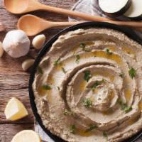 Baba ghanoush · Chopped garlic, roasted eggplant dip with olive oil.