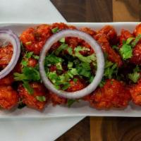 Gobi Manchurian · Indo-Chinese, tangy tomato flavored cauliflower with bell peppers.