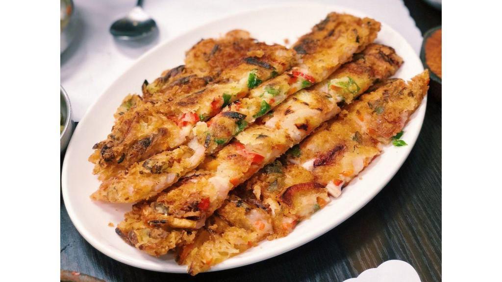 Seafood Pancake · Squid, clam, imitation crab, and grilled onions fried in batter.