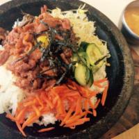 BBQ Pork & Vegetables in Stoneware · Rice, BBQ sliced spicy pork, and vegetables served in stoneware with an assortment of kimchi...