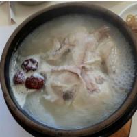 Ginseng Chicken · Boiled chicken with ginseng, milk vetch root, jujube, and sticky rice, served in chicken bro...