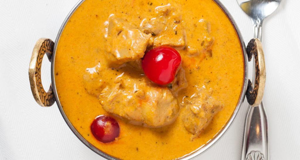 Butter Chicken · Boneless chicken cooked in mild buttery sauce and herbs.