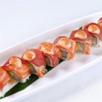 X Roll · Popular.  Hamachi, avocado roll topped with tuna, salmon and spicy cream sauce.