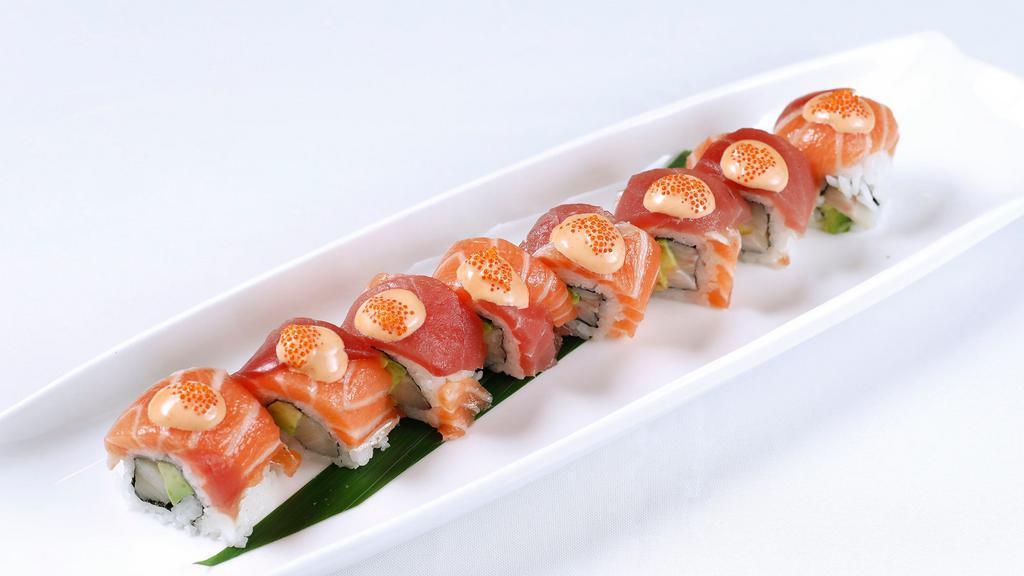 X Roll · Popular.  Hamachi, avocado roll topped with tuna, salmon and spicy cream sauce.