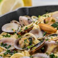 Linguine Alle Vongole · Fresh garlic, manila clams, Italian parsley, white wine sauce.