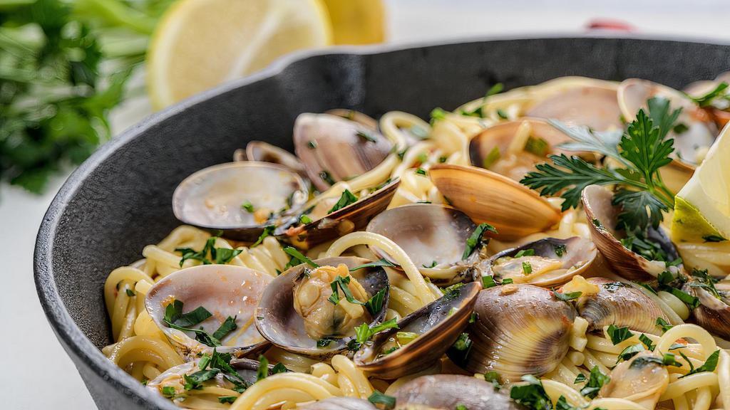 Linguine Alle Vongole · Fresh garlic, manila clams, Italian parsley, white wine sauce.