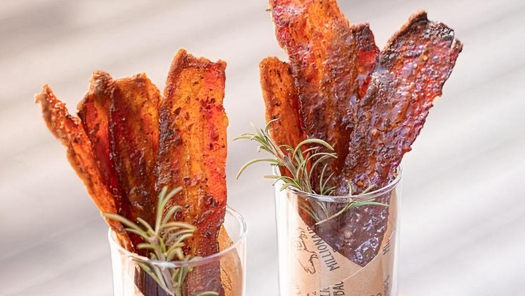 Millionaire's Candy® Bacon · Introducing candied bacon, cooked well done, perfect thickness.... easy to enjoy. . Four delectable slices in a  cup.. From Our beloved Millionaire's Bacon family.