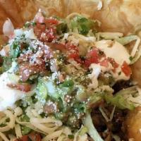 Taco Salad · Choice of meat, refried beans, lettuce, guacamole, sour cream, cheese, and pico de gallo.