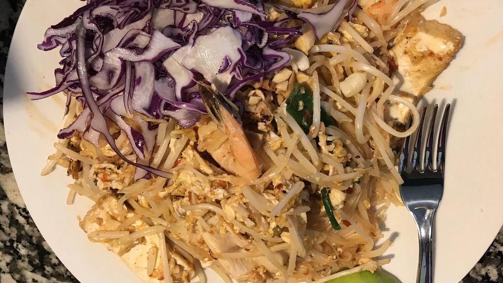 77. Pad Thai · Shrimp, chicken, tofu, egg, peanut, and bean sprout with pan-fried Thai style rice noodles. ( Spicy or mild )