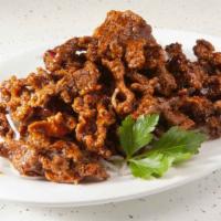 Tangerine Beef · Hot & spicy. Deep fried beef with tangerine peels in spicy and sweet sauce.