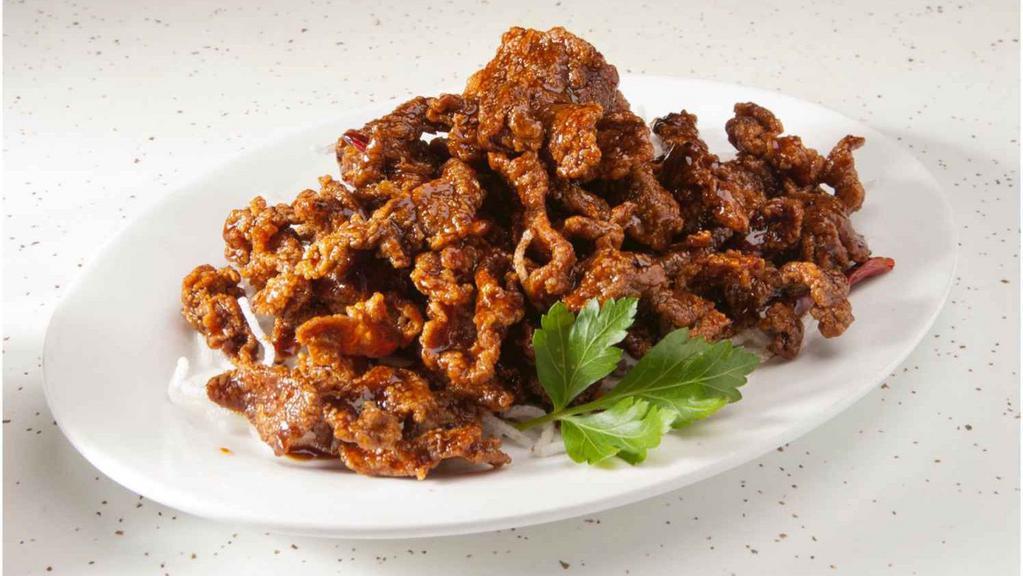 Tangerine Beef · Hot & spicy. Deep fried beef with tangerine peels in spicy and sweet sauce.