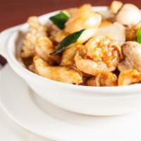 Seafood w/ Tofu in Clay Pot · Prawns, scallops, squids, fish fillet, crab stick, fried tofu, zucchini, mushroom and onion ...