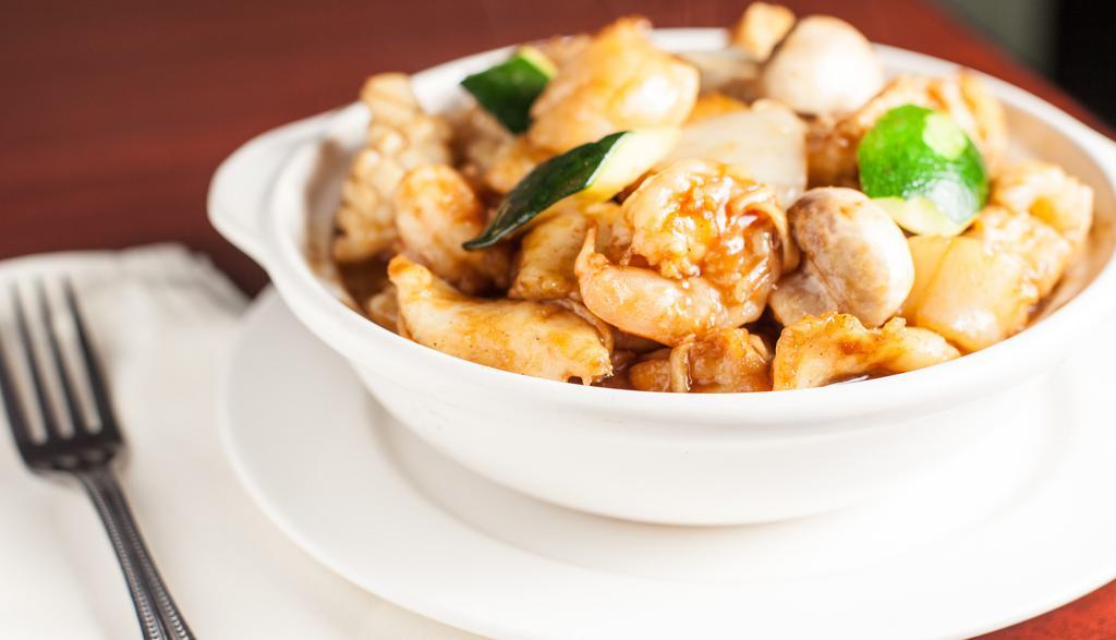 Seafood w/ Tofu in Clay Pot · Prawns, scallops, squids, fish fillet, crab stick, fried tofu, zucchini, mushroom and onion in garlic sauce.