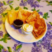 Bliny · Four thin European-style crepes with jam and sour cream.