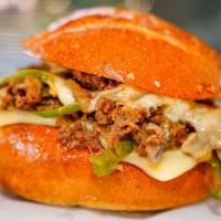 Cheesesteak · Chopped, thinly sliced steak on a french roll with mayo, cheese, sautéed onion, and bell pep...