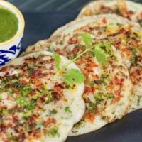 Uttappam · Pancake style thicker dosa with onion and green chilli