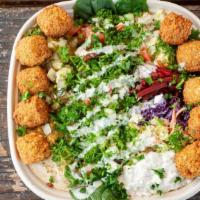 Falafel Salad · Israeli salad, hummus, pickles, sauerkraut, baba ghanoush, ten falafel balls, and tahini sau...