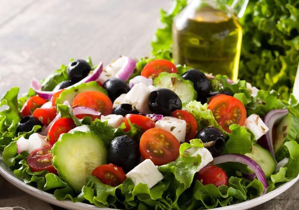 Greek Salad · Romaine hearts, tomatoes, cucumber, red onions, feta cheese, kalamata olives, lemon juice, and olive oil.