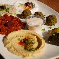 Appetizer Combo Plate · Hummus, baba ghanoush, tzatziki, shakshuka, dolma, and falafel. No substitution.