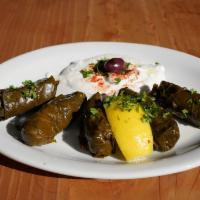 Dolma (5 Pieces) · Gluten free. Grape leaves, rice, shallots, currant, and mint. Served with pita bread.