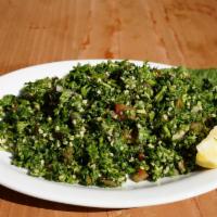 Tabouli Salad · Authentic Lebanese parsley salad, bulgur, diced tomatoes, onion and fresh mint.
