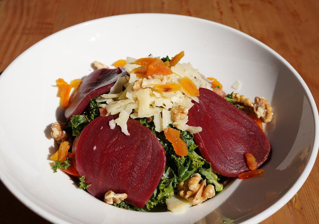 Kale Salad · Quinoa, lentil, tomatoes, walnuts, roasted beets, dried apricots, shaved Parmesan cheese, and lemon olive oil dressing.