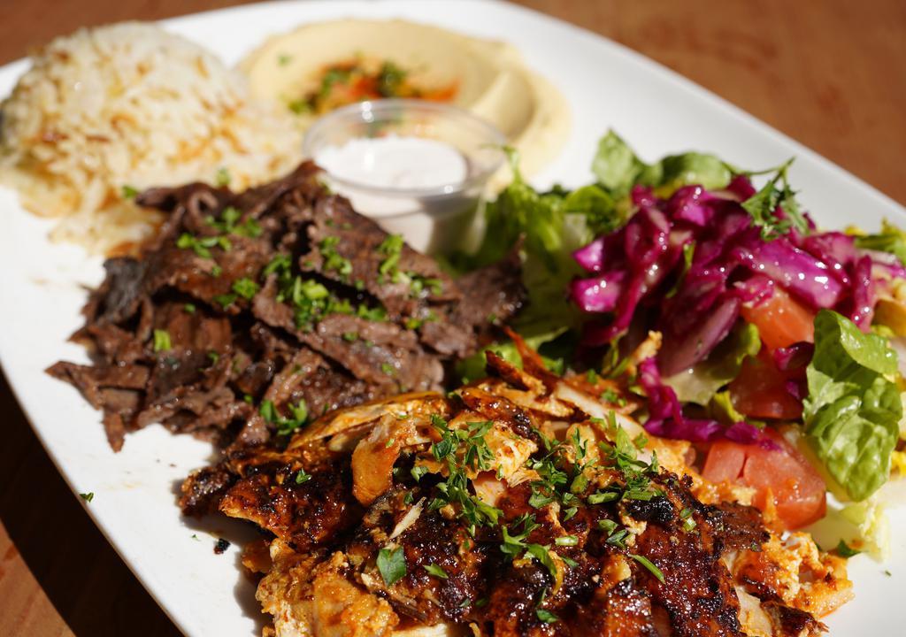 Combo Gyros Plate · Slow cooked, thinly sliced, marinated lamb & beef gyros-chicken gyros. Served with rice, salad, hummus and pita.
