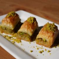 Baklava · Phyllo layers, walnuts, pistachio and simple syrup.