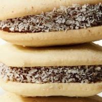 Gluten Free Traditional Alfajor · Shortbread cookies, made with no gluten ingredients, joined with dulce de leche and rolled i...