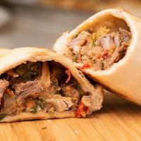 Beef Empanada · Our House made Beef empanadas are made with grass fed ground beef, red and white onions, gre...
