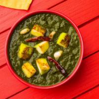 Palak Paneer · A puree of spinach, simmered with cubed cottage cheese. This traditional entree is made with...
