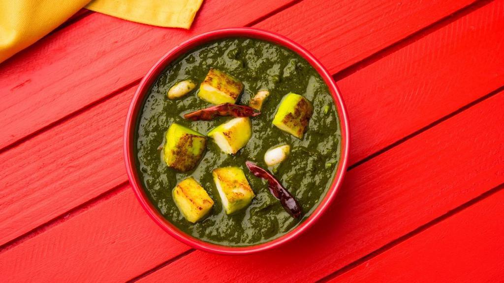 Palak Paneer · A puree of spinach, simmered with cubed cottage cheese. This traditional entree is made with our signature spices.