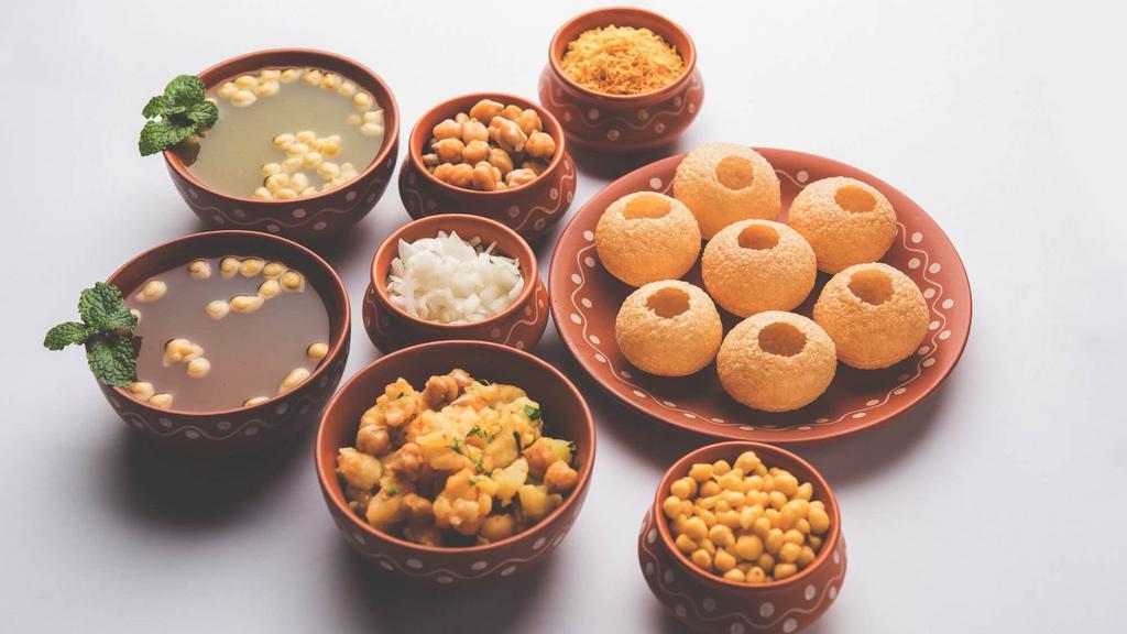Pani Puri · From the streets of India, Ball-shaped, hollow puris (a deep-fried crispy crep ), filled with a mixture of chickpeas, potatoes, chutneys, and other fillings. Served with mouth watering fresh mint-flavored water