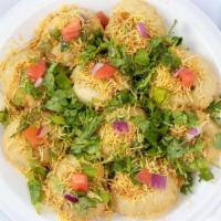 Sev Puri · Fried flat chips coated with yogurt dipping sauce and our signature chutneys