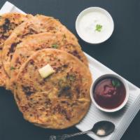 Mooli Paratha XL · Jumbo whole wheat flatbread stuffed with grated mooli (white radish) and lightly seasoned wi...