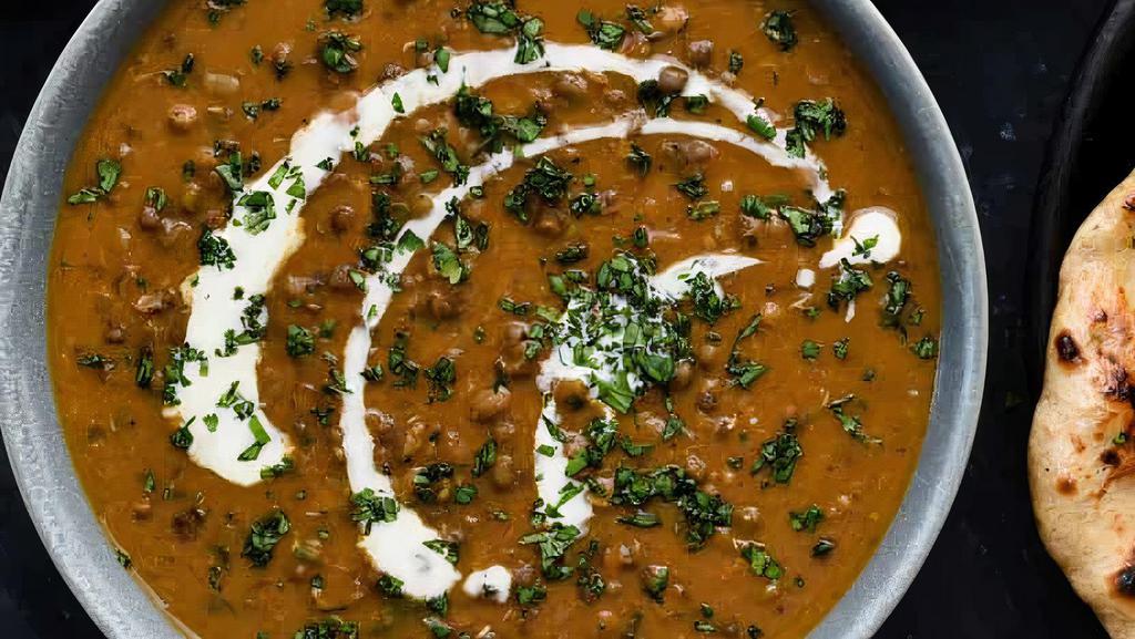 Daal Makhani · Gluten free. Whole black lentils simmered on low fire with red chili, ginger, garlic, tomatoes and ghee.