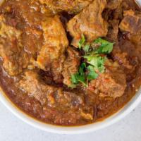 Lamb Rogan Curry · Gluten free. Stewed Colorado lamb chunks, blend of spices, brown onion and tomatoes.