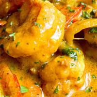 Shrimp Curry · Gluten free. Shrimp cooked in tomato, mustard seeds, garlic, curry leaf, coconut milk and sp...
