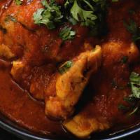 Chicken Curry · Gluten free. Boneless chicken cooked with cumin, turmeric, ginger, garlic, onion, tomato and...