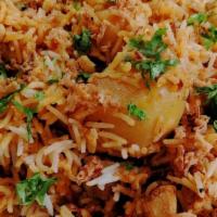 Chicken Biryani · Gluten free. Saffron basmati rice, chicken, mint, fried onions cooked in dum style.