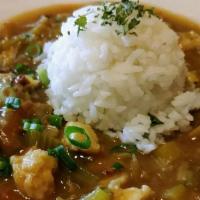 Gumbo with Rice (Shrimp) · A strongly flavored stew served with a scoop of rice.