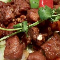 Wok Tossed Beef Steak Cubes (Bò Lúc Lắc) · A very popular Vietnamese dish. Tender flank steak is cut into cubes and marinated in our sp...