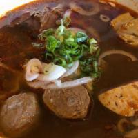 Bun Bo Hue (Spicy Noodle) · Central vietnamese noodle soup infused with lemongrass and spices come with sliced filet mig...