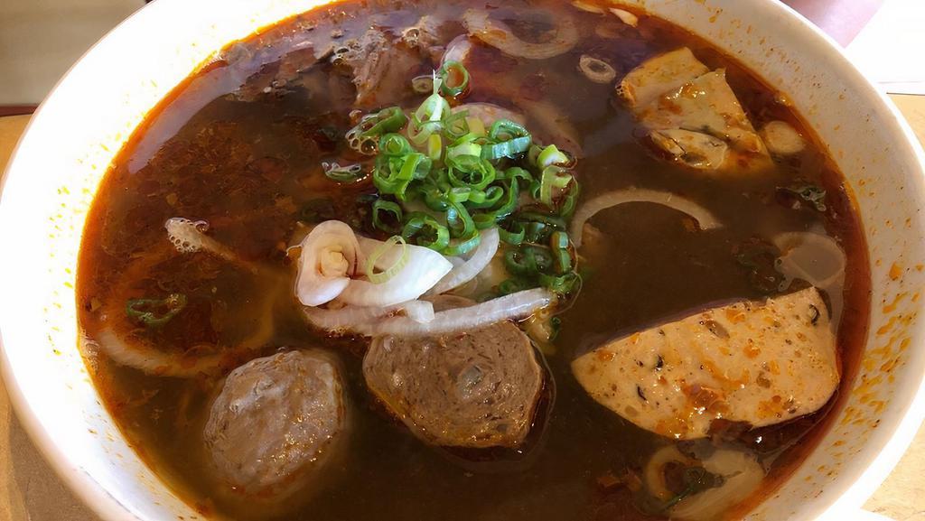 Bun Bo Hue (Spicy Noodle) · Central vietnamese noodle soup infused with lemongrass and spices come with sliced filet mignon, beef brisket, pork roll and beef ball.