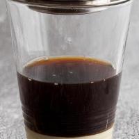 Vietnamese Drip Coffee with Condensed Milk · Served either hot or with ice.