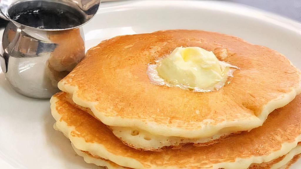 Buttermilk Pancakes · Butter and house syrup.