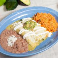 Enchiladas Suizas · Two corn tortillas with shredded chicken. Topped with our spicy green tomatillo sauce, chees...