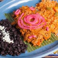 Cochinita Pibil · A succulent Mayan dish from yucatán. Pork slowly braised in banana leaves, fresh fruit juice...